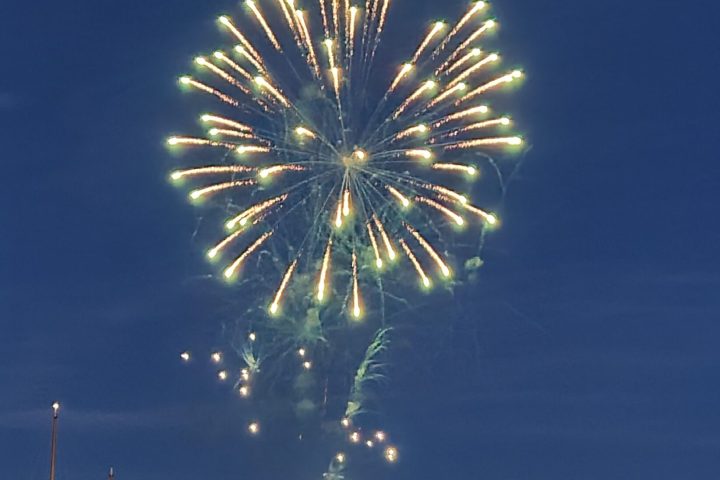Boothbay harbor fireworks display in the sky over water on fireworks cruise