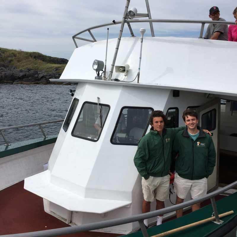 a man standing next to a boat