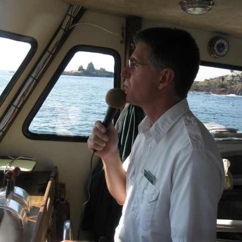 a man drinking from a boat