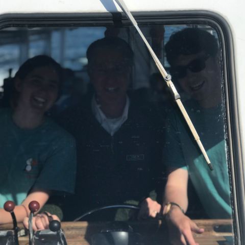 a group of people sitting on a bus