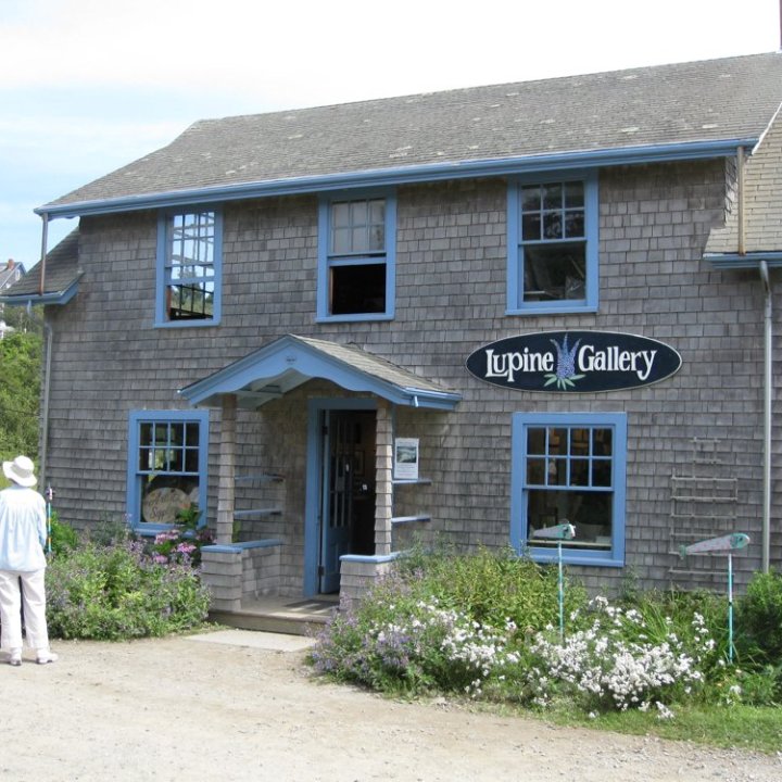 a house in front of a brick building