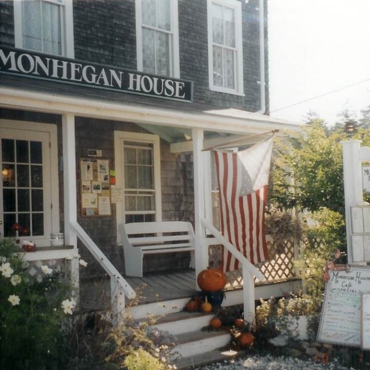 a sign in front of a building