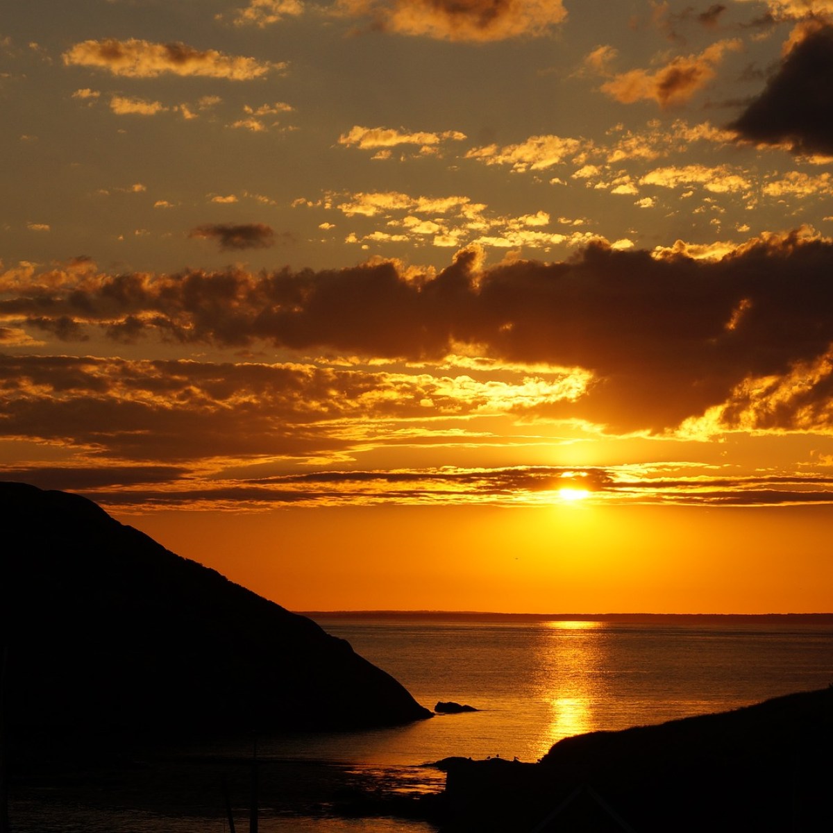 a sunset over a body of water