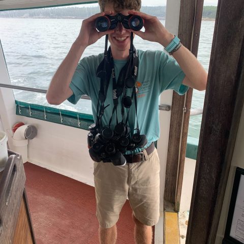 a man that is standing in the water