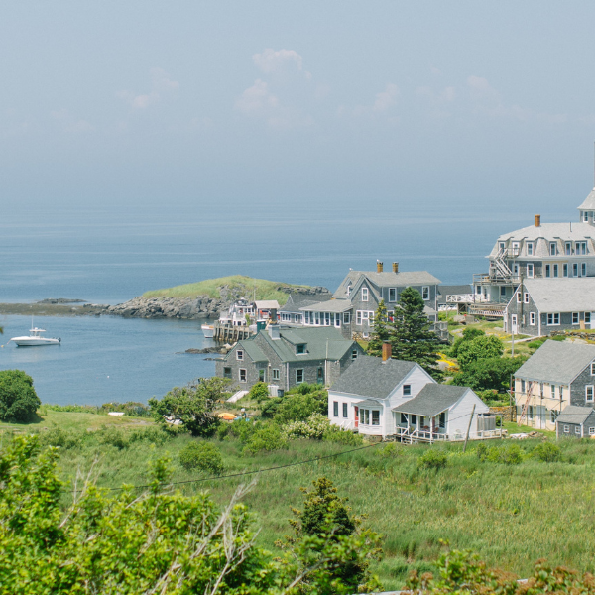 a landscape view of the monhegan island hotel and town center